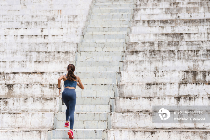 Women are exercising and jogging up the stairs.