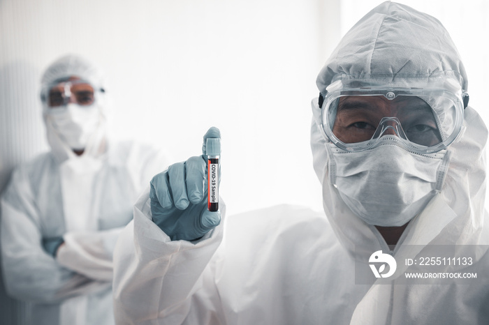 Doctor carried a blood vessel that was a plasma sample of a patient infected with the coronavirus or Covid-19. An experiment to produce a vaccine for the treatment of disease in an aseptic lab.