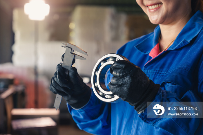 the abstract image of the technician maturing the ball bearing in the industrial factory. the concept of clean energy, futuristic, industrial4.0 and internet of things.