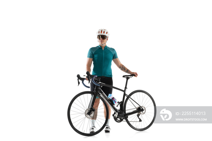 Young professional female bike rider on road bike isolated over white background.