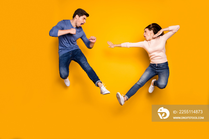 Full length photo of spotive two students people have workout combat fight kick hands legs jump wear casual style clothing denim jeans isolated over shine color background