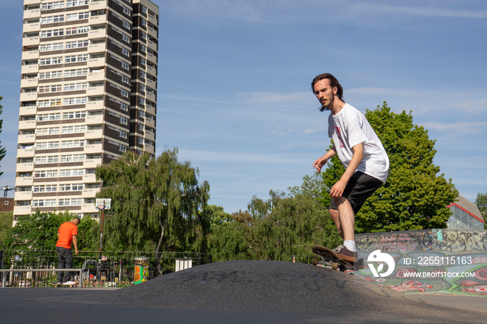 Young man skateboarding in skate park