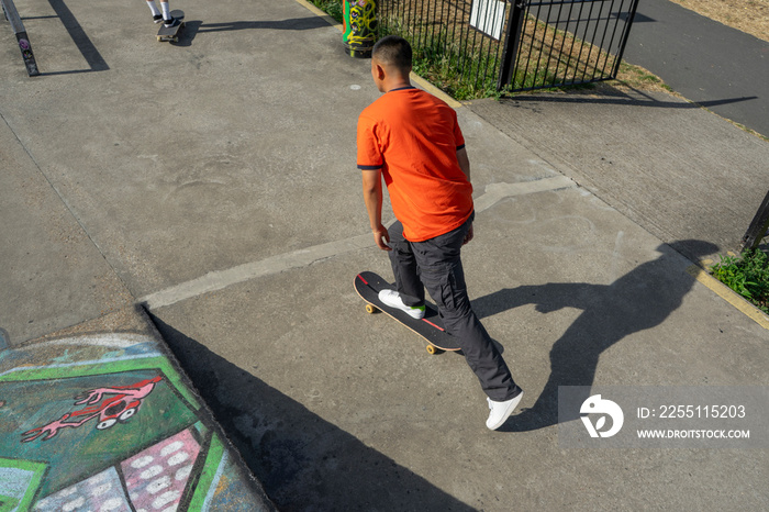 Young man skateboarding in skate park