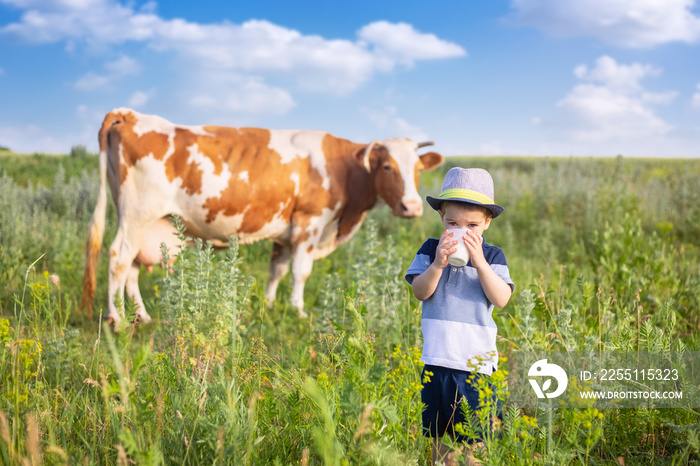 little boy drinking milk outdoors