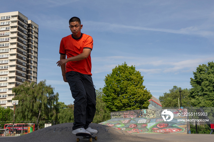 Young man skateboarding in skate park