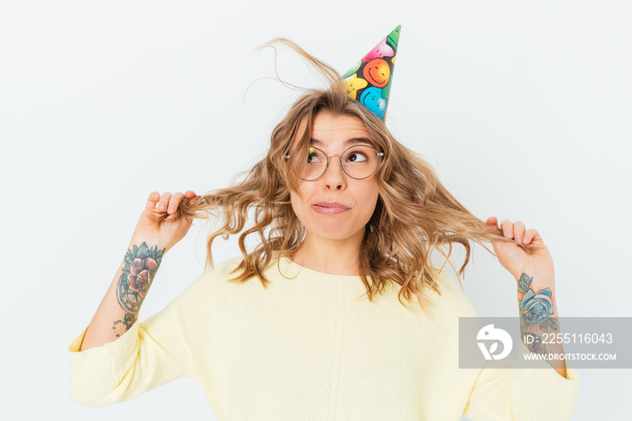 Portrait cheerful funny blonde girl wearing festive cap