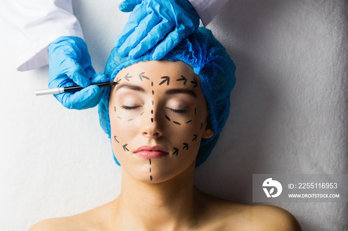 Peaceful young patient with dotted lines on the face