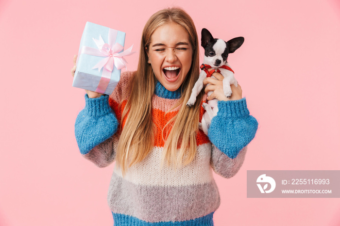 Cute lovely excited girl holding her pet chihuahua