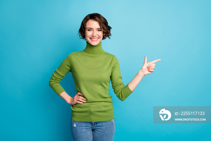 Portrait of positive girl promoter point index finger copyspace indicate adverts promo recommend suggest select wear good look clothes isolated over blue color background