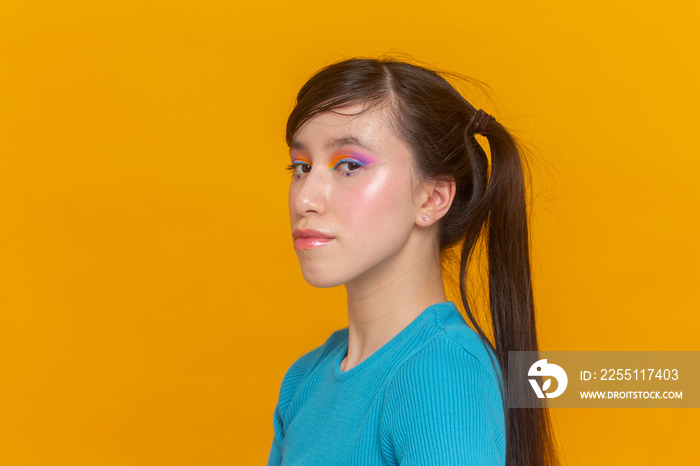 Studio portrait of girl with colorful make-up