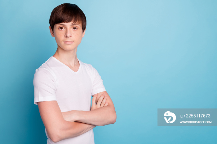 Photo of serious unhappy boy seeming to have been disappointed while isolated with blue background