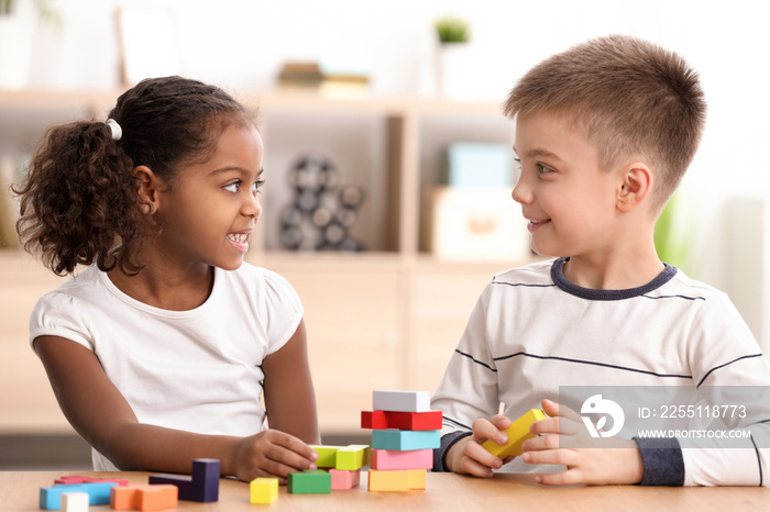 Little kids playing indoors. Child adoption