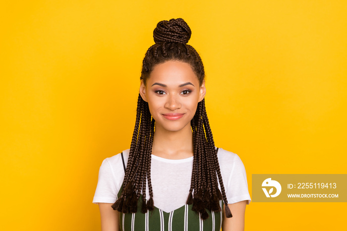 Portrait of attractive cheery content brown-haired girl wearing modern hairdo isolated over bright yellow color background