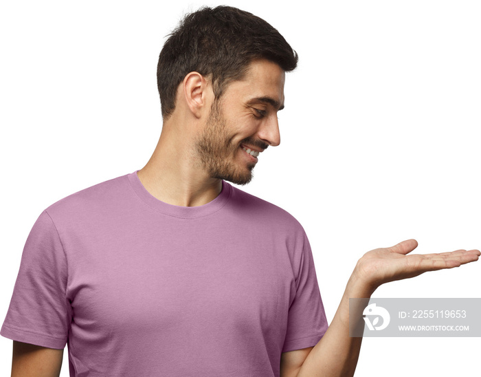 Young smiling man showing on the right with palm or empty hand. Copy space for your product