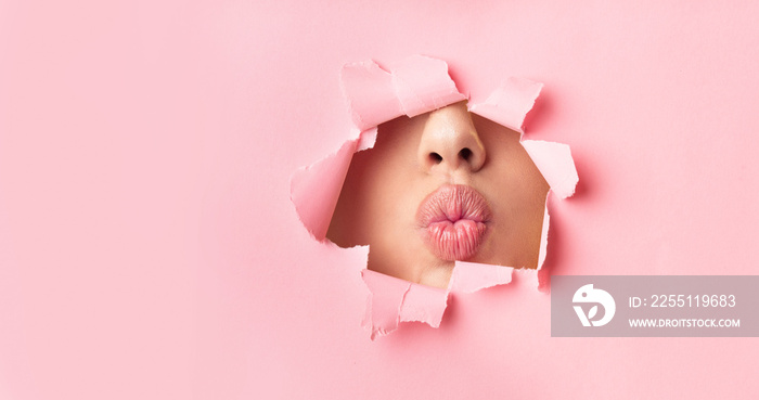 Unrecognizable Girl Pouting Lips Through Hole In Paper, Beauty Background