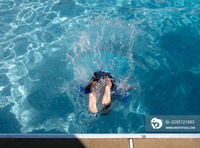 Swimming in a crystal clear swimming pool to beat the summer heat