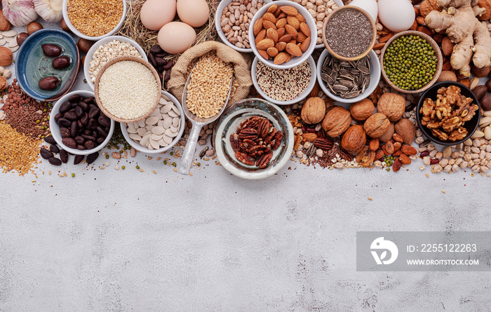 Ingredients for the healthy foods selection. The concept of superfoods set up on white shabby concrete background with copy space.