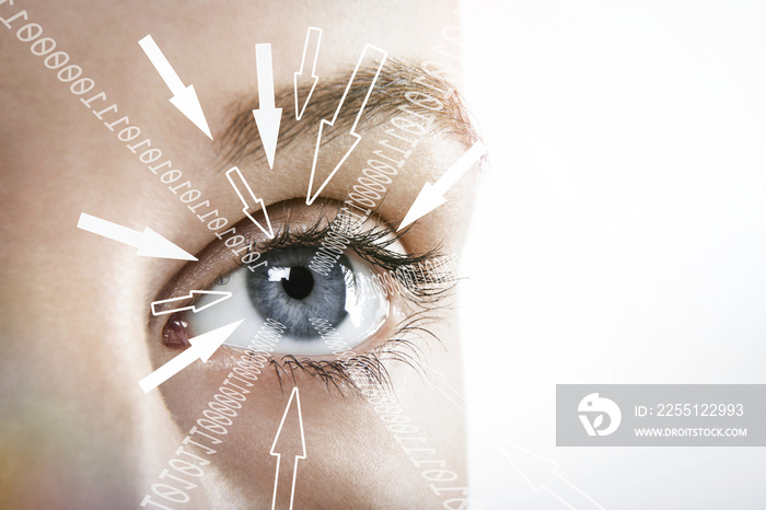 Woman’s eyes with technology data information flowing into them