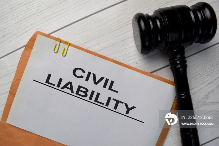 Civil Liability text with document brown envelope and gavel isolated on office desk.