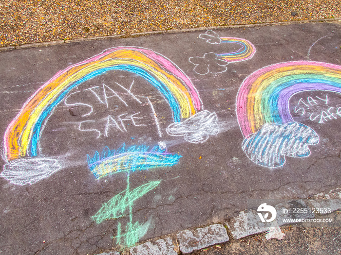 Stay Safe Chalk Drawing Words and Rainbow on Pavement