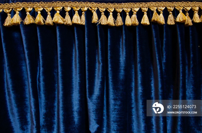 Navy blue velvet curtain with gold brocade fringe at top - image