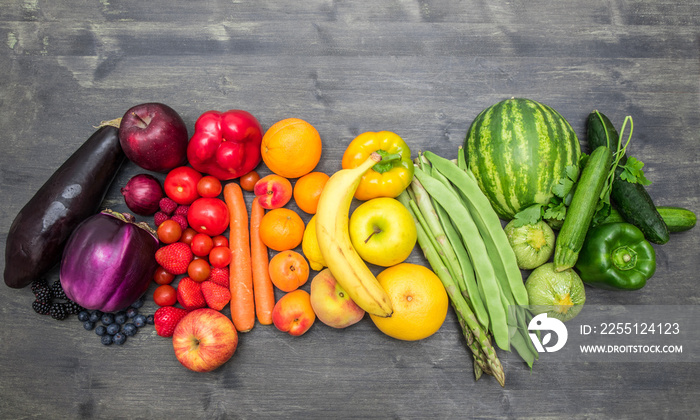 rainbow fruit and vegetables on wood