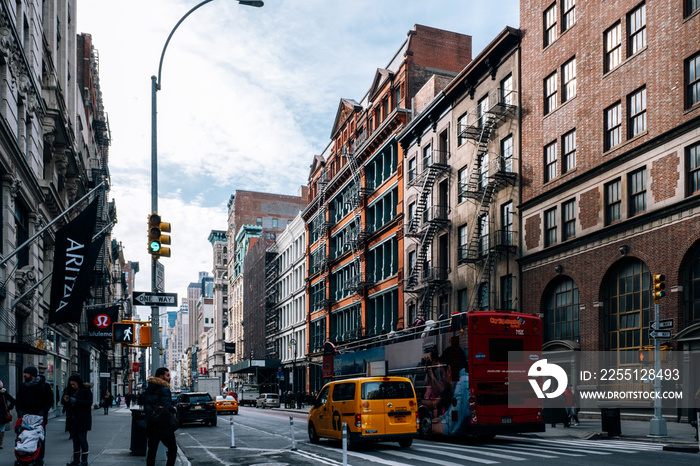 Early morning traffic and tourist walking on the Broadway in SOHO New York City