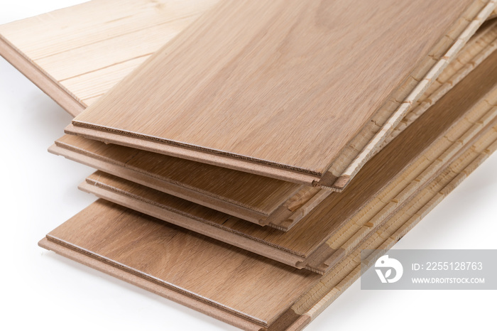 Oak engineered wood flooring boards in stack, fragment close-up