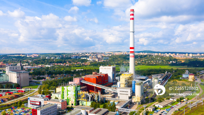 Modern combined heat and power plant. Big chimney with sulphur removal unit. Heavy industry from above. Power and fuel generation in European Union