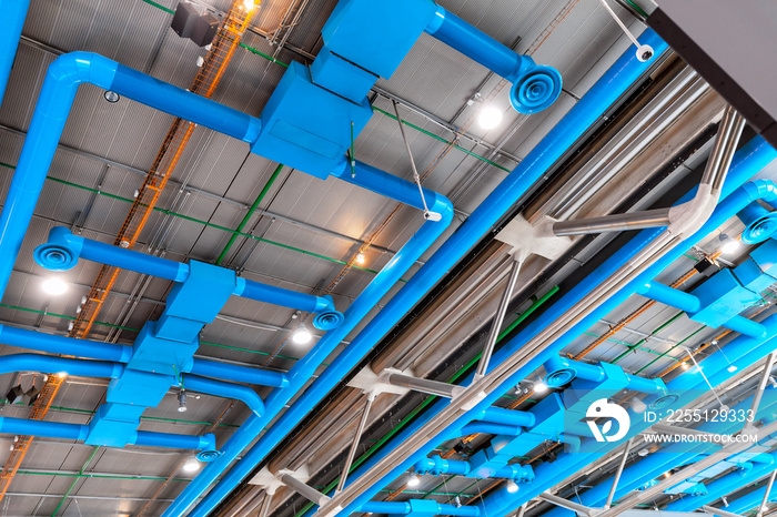 Industrial building ceiling with ventilation system pipes