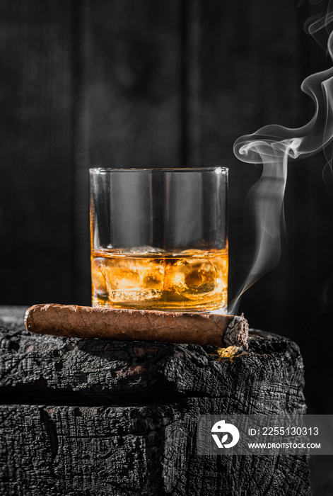 Smoking cigar and a glass of whiskey