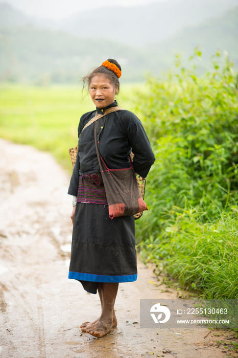 Portrait of young woman on dirt track, Shan State, Keng Tung, Burma