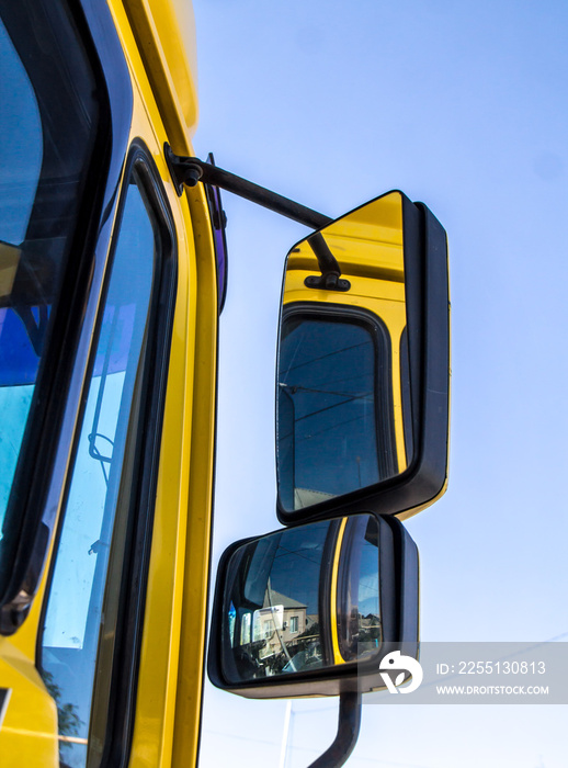 Mirrors of a lorry on a sky background