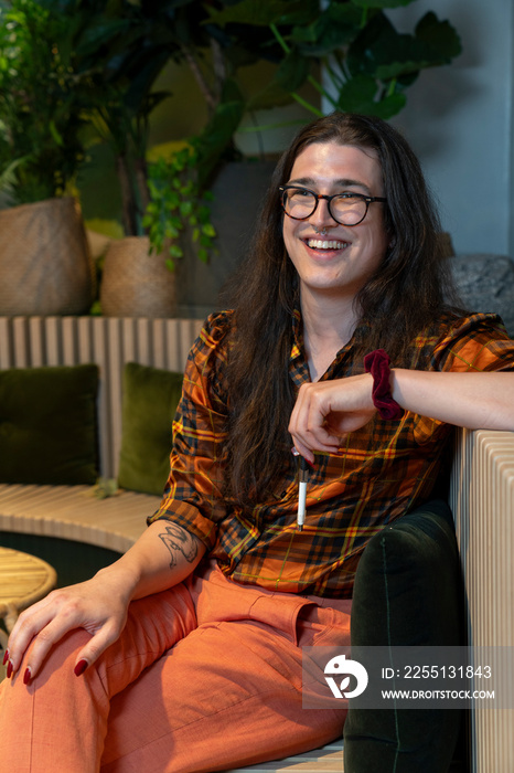 Portrait of young businessman sitting in office