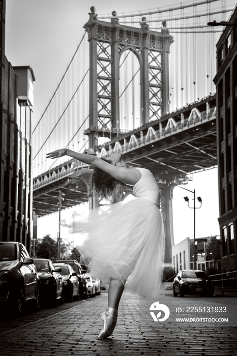 Elegant ballet dancer woman dancing ballet in the city