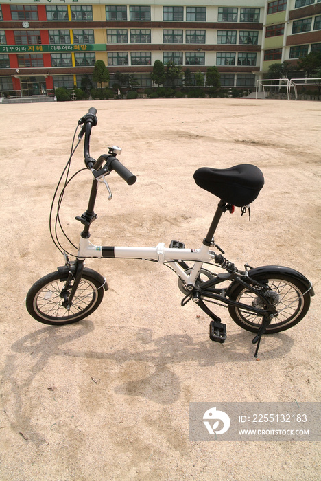 Folding bicycle on the playground.