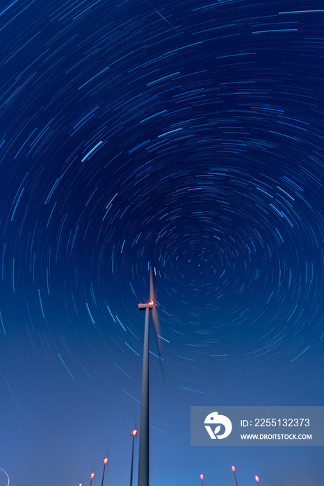 wind turbine farm at night