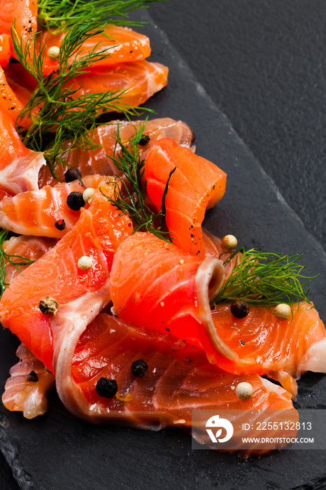 Smoked Salmon with peppercorns and dill close up