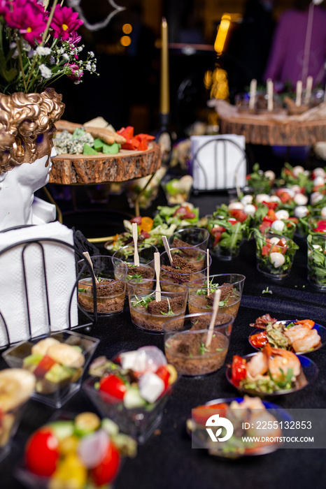 snacks in a plastic cup on the buffet catering