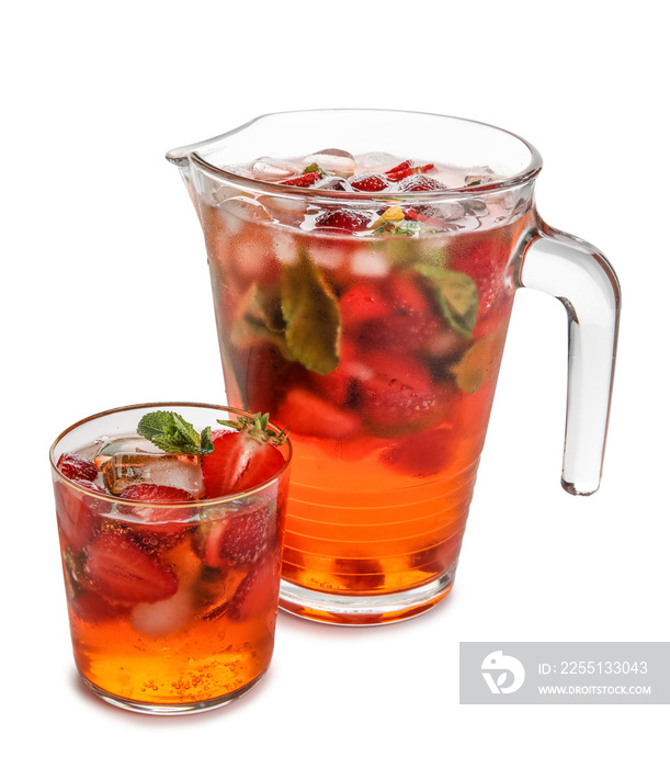 Glass and jug of strawberry lemonade on white background