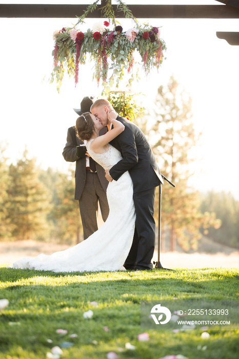 Young couple 1st kiss at alter