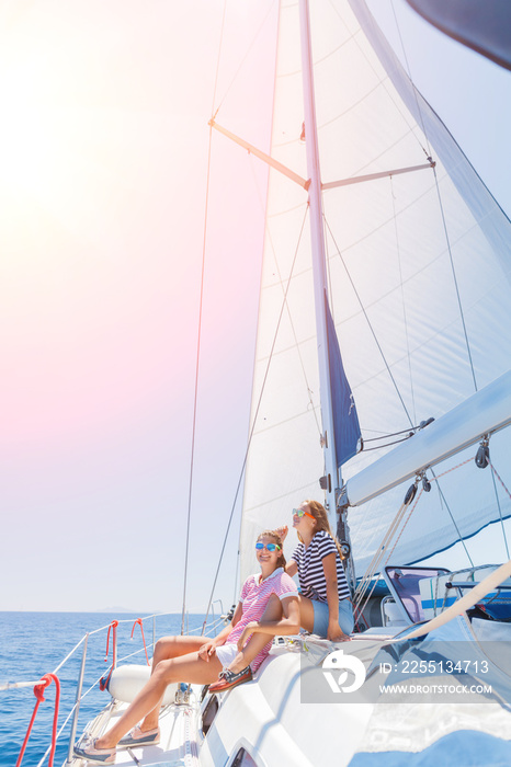 Beautiful Girl relaxing with her friend On Yacht in Greece