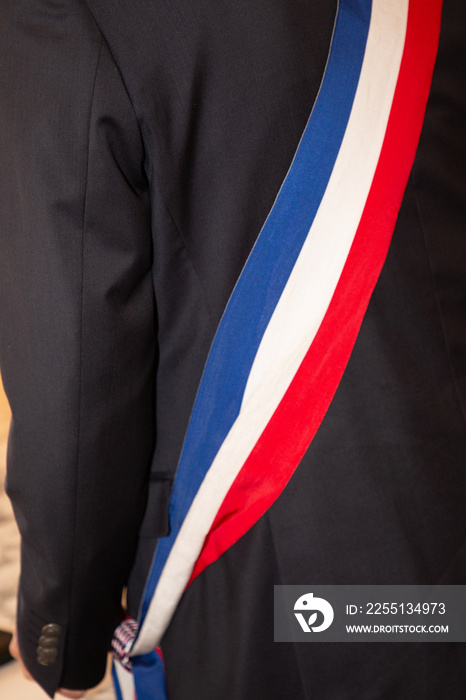 mayor man scarf during ceremony in france