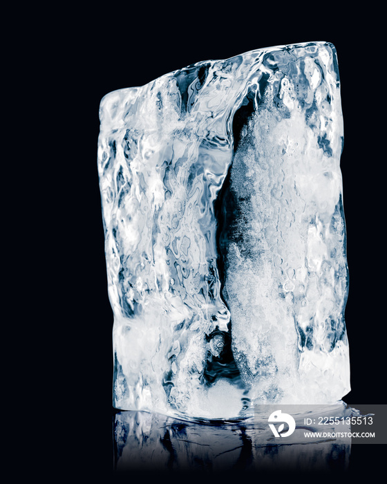 Textured ice block on black reflective background.