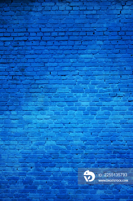 The texture of the brick wall of many rows of bricks painted in blue color