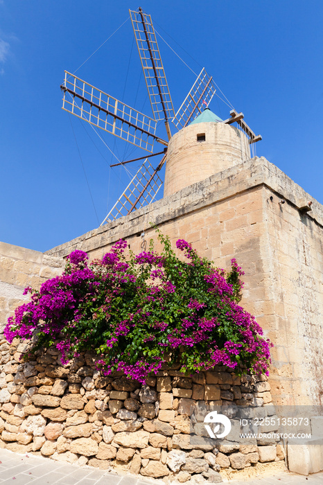 Old windmill under blue sky on a sunny day. Xaghra Ggantija, Malta