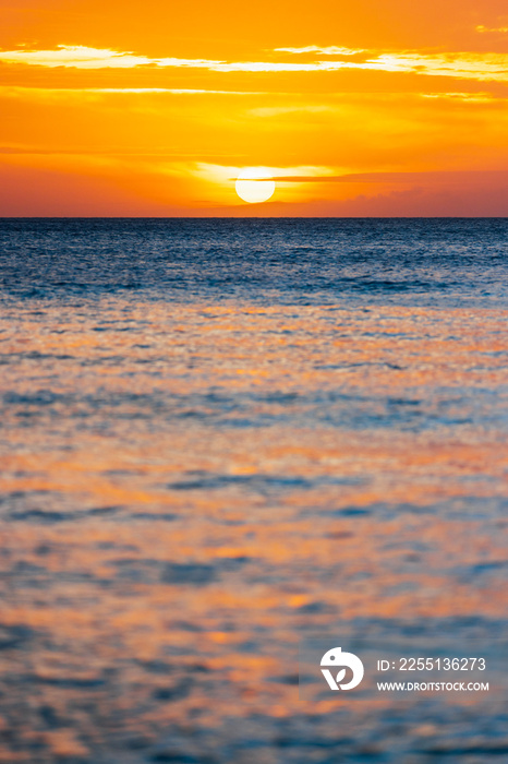 Golden skyline during sunset with sailboats in Boracay, Aklan, Philippines