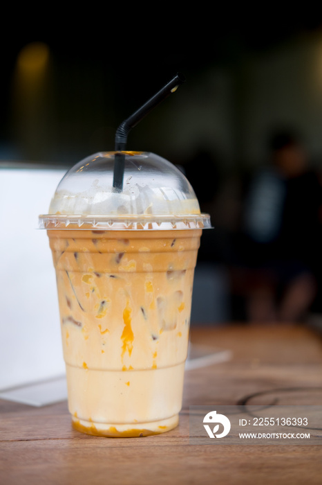 Caramel macchiato iced coffee with straw