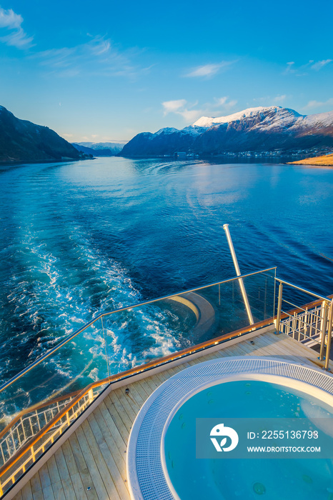 Above outdoor view of Hurtigruten voyage in cruise along Norwegian coast with a luxury swimming pool with a gorgeous nature background