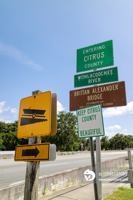 Rooadside signs on the Brittan Alexander Bridge in Dunnellon, Florida, USA